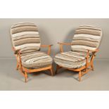 A PAIR OF ERCOL MODEL 203 ELM AND BEECH SPINDLE BACK WINDSOR ARMCHAIRS, (condition: worn armrests,