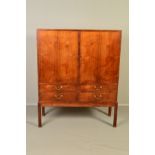 A DANISH 1960'S/70'S TEAK DOUBLE DOOR CABINET ON STAND, revealing two compartments with beech