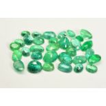 A SELECTION OF OVAL CUT EMERALDS, measuring approximately 3.9mm x 2.8mm - 7.1mm x 5.1mm, approximate