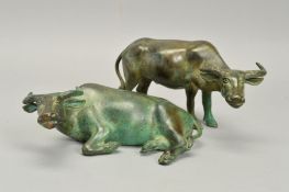TWO SECOND HALF OF THE 20TH CENTURY GREEN PATINATED BRONZE FIGURE OF WATER BUFFALO, one standing,
