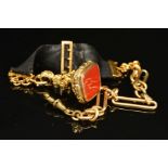 A VICTORIAN FANCY SINGLE ALBERT CHAIN, together with a black ribbon fob, suspending a gold-plated