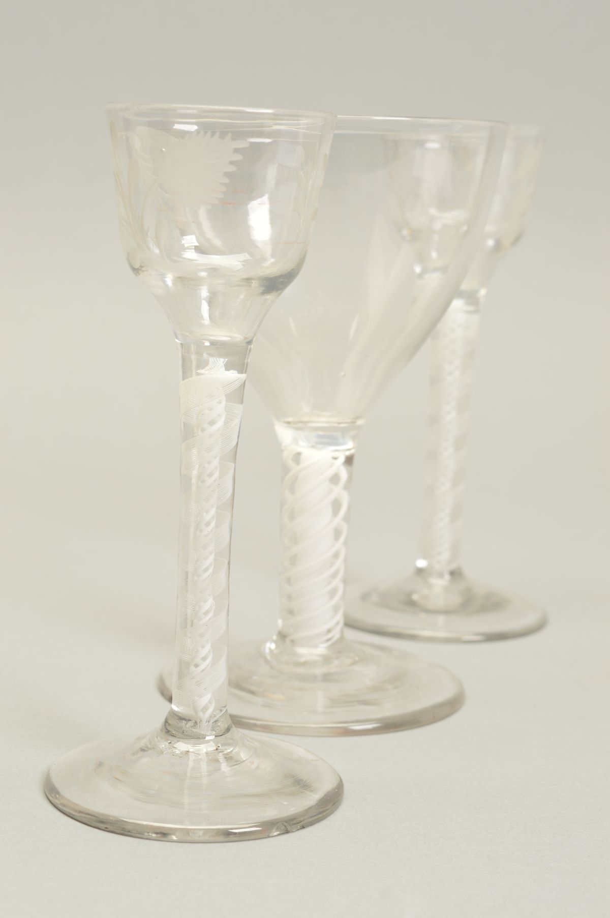 A PAIR OF 18TH CENTURY CORDIAL GLASSES, the ogee bowls engraved with flower head, leaves and a - Image 2 of 5