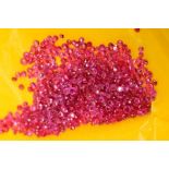 A SELECTION OF SMALL ROUND RUBIES, measuring approximately 1.5mm - 2.5mm in diameter, approximate