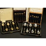 A CASED SET OF SIX ELIZABETH II SILVER GILT AND HARLEQUIN ENAMEL COFFEE SPOONS, circular seal end