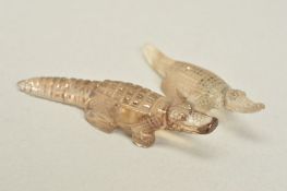 TWO CARVED CROCODILE ORNAMENTS, rutile quartz and dendritic measuring approximately 8cm long
