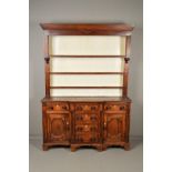 AN EARLY 19TH CENTURY OAK, MAHOGANY BANDED AND INLAID DRESSER AND PLATE RACK, the plate rack with