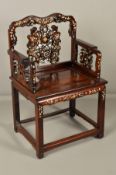 A LATE 19TH CENTURY CHINESE HARDWOOD ELBOW CHAIR, the serpentine back with pierced scrolling