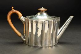 A GEORGE III SILVER TEAPOT, of fluted oval form, fruitwood finial and handle, the domed cover