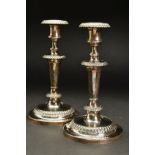 A PAIR OF VICTORIAN SILVER CANDLESTICKS, egg and tongue cast rims, detachable sconces on urn