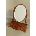 A GEORGE III MAHOGANY TOILET MIRROR, with satinwood and ebony banding, oval mirror on scrolled