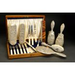 A GEORGE V OAK CASED CANTEEN OF SILVER AND IVORY FISH EATERS, six place settings, knives with