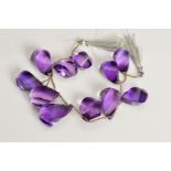AMETHYST TWISTED DROP BEADS, briolette shape, comprising eleven beads, strung on 190mm string, beads