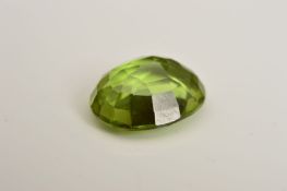 AN OVAL MIX CUT PERIDOT, measuring approximately 12mm x 8mm, weighing 3.88ct