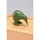A SMALL HAND CARVED NEPHRITE KIWI BIRD, measuring approximately 4.5cm x 3cm, complete with box