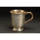 AN ELIZABETH II SILVER MUG, of cylindrical form with flared rim, scrolled handle, stepped circular