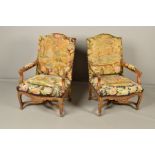 A PAIR OF 19TH CENTURY LOUIS XIV STYLE CARVED AND GILTWOOD FAUTEUILS WITH TAPESTRY UPHOLSTERY AND