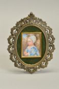 AFTER VAN DYCK, an early 20th Century portrait miniature of a young child holding a piece of