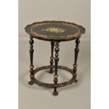 AN EARLY 20TH CENTURY EBONISED WOOD AND PAPIER MACHE WAVY OVAL OCCASIONAL TABLE, printed and painted