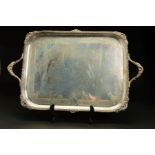 A LATE VICTORIAN SILVER TWIN HANDLED TRAY, of rectangular form, the handles cast with shells,