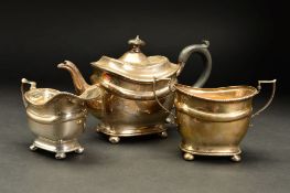 AN EDWARDIAN SILVER THREE PIECE BACHELOR'S TEASET, of oval form, engraved initial 'M' to each piece,