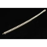 A MID TO LATE 20TH CENTURY DIAMOND LINE BRACELET, measuring approximately 180mm in length, each