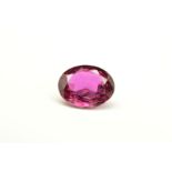 A MIX CUT OVAL RUBY, measuring approximately 7.9mm x 6.5mm, weighing 1.59ct, surface reaching
