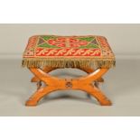 A VICTORIAN OAK STOOL OF GOTHIC DESIGN IN THE STYLE OF PUGIN, the rectangular seat with