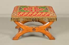A VICTORIAN OAK STOOL OF GOTHIC DESIGN IN THE STYLE OF PUGIN, the rectangular seat with