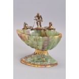 A CARVED FLUORITE TABLE SALT, of shell form, the rim with a gilt metal casting of Neptune and