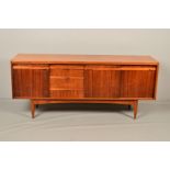 A WHITE AND NEWTON 1960'S TEAK SIDEBOARD, with rosewood finish fronts comprising three central