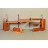 NILS STRINNING FOR STRING, a low teak floor standing three section wall shelving system, comprised