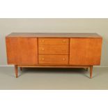 A WRIGHTON TEAK SIDEBOARD, cupboard doors flanking three central drawers, brass tulip handles on