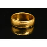 A LATE 20TH CENTURY 22CT GOLD WEDDING BAND, plain polished with a bead edge, measuring approximately