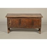 A 17TH CENTURY OAK BOARDED CHEST, the rectangular top and front with simple carved line detail,