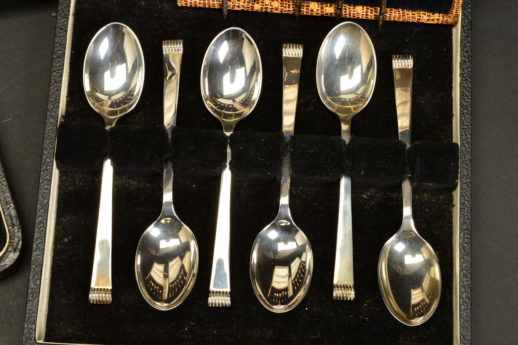 A CASED SET OF SIX ELIZABETH II SILVER GILT AND HARLEQUIN ENAMEL COFFEE SPOONS, circular seal end - Image 3 of 4