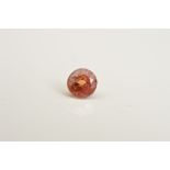 A ROUND MIX CUT ORANGE SAPPHIRE, measuring approximately 4.1mm in diameter, weighing 0.44ct