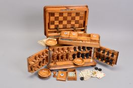 A VICTORIAN OLIVE WOOD GAMES COMPENDIUM, of rectangular form, the hinged lid with an enamelled