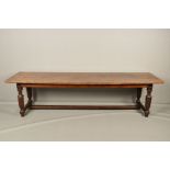 A 19TH CENTURY OAK DINING TABLE, of rectangular form, the triple plank top with carved initials/
