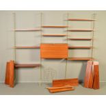 NILS STRINNING FOR STRING, a tall teak floor standing three section wall shelving system,