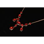 A CONTINENTAL GARNET SET NECKLET, fringe design with assorted size garnets, cut down foil back