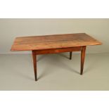 AN EARLY 19TH CENTURY FRENCH RECTANGULAR FRUITWOOD DINING TABLE, the top formed of six planks with