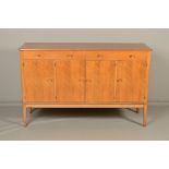 GORDON RUSSELL OF BROADWAY, a 1960's walnut sideboard with two drawers above central double cupboard