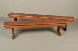 TWO VICTORIAN OAK CHAPEL BENCHES, plain rectangular tops above shaped ends with trefoil cut aways,