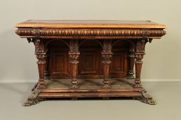 A LATE 19TH CENTURY CONTINENTAL WALNUT AND STAINED HALL TABLE, with veined red marble inset top, the