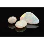 A SELECTION OF THREE PRECIOUS WHITE OPALS, flashes of blues, greens, yellow and orange seen on