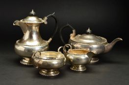 A GEORGE V SILVER FOUR PIECE TEASET, of circular form, comprising teapot, hot water jug, twin