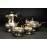 A GEORGE V SILVER FOUR PIECE TEASET, of circular form, comprising teapot, hot water jug, twin