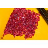 A SELECTION OF SMALL ROUND RUBIES, measuring approximately 2mm in diameter, approximate combined