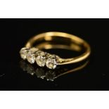 A LATE 20TH CENTURY FOUR STONE DIAMOND RING, estimated total diamond weight 0.35ct, colour