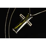 A MODERN DIAMOND AND GREEN TOURMALINE LARGE CROSS PENDANT, centring on a long rectangular tourmaline